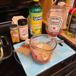 sauce ingredients collected and started in the measuring cup with pour spout