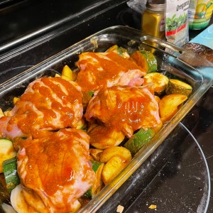 use all of the sauce - half on the veggies first and the remaining amount on the chicken placed on top of the veggies in the backing dish